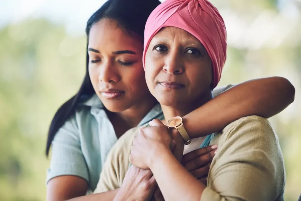 Women Hugging Breast Cancer Survivor