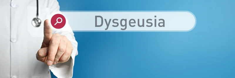 A doctor clicking a search box to learn more about Dysgeusia so he can get rid of metallic taste