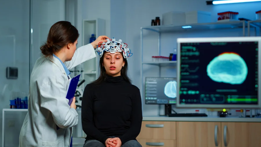 A woman getting her brain scanned as she explores DBS surgery as an alternative to taking Parkinson's disease medication which gives her a dry mouth and metallic taste.