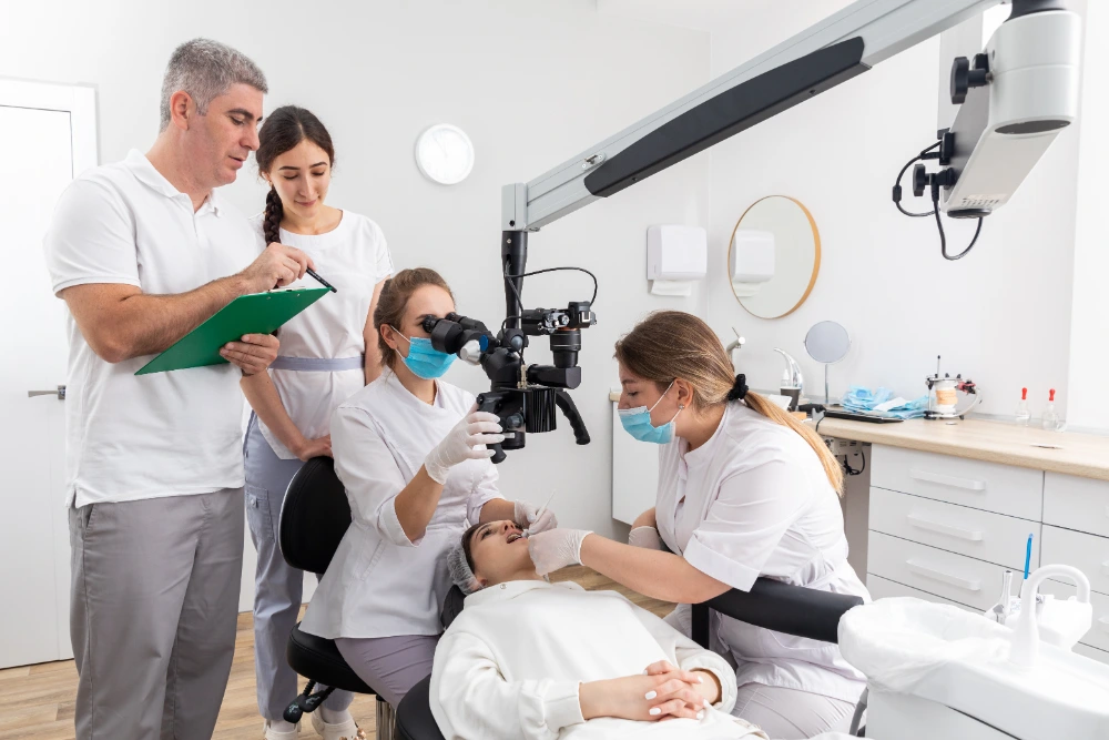  A team of dentists examining a patient to find out the root cause of her Bad Taste in Mouth. 