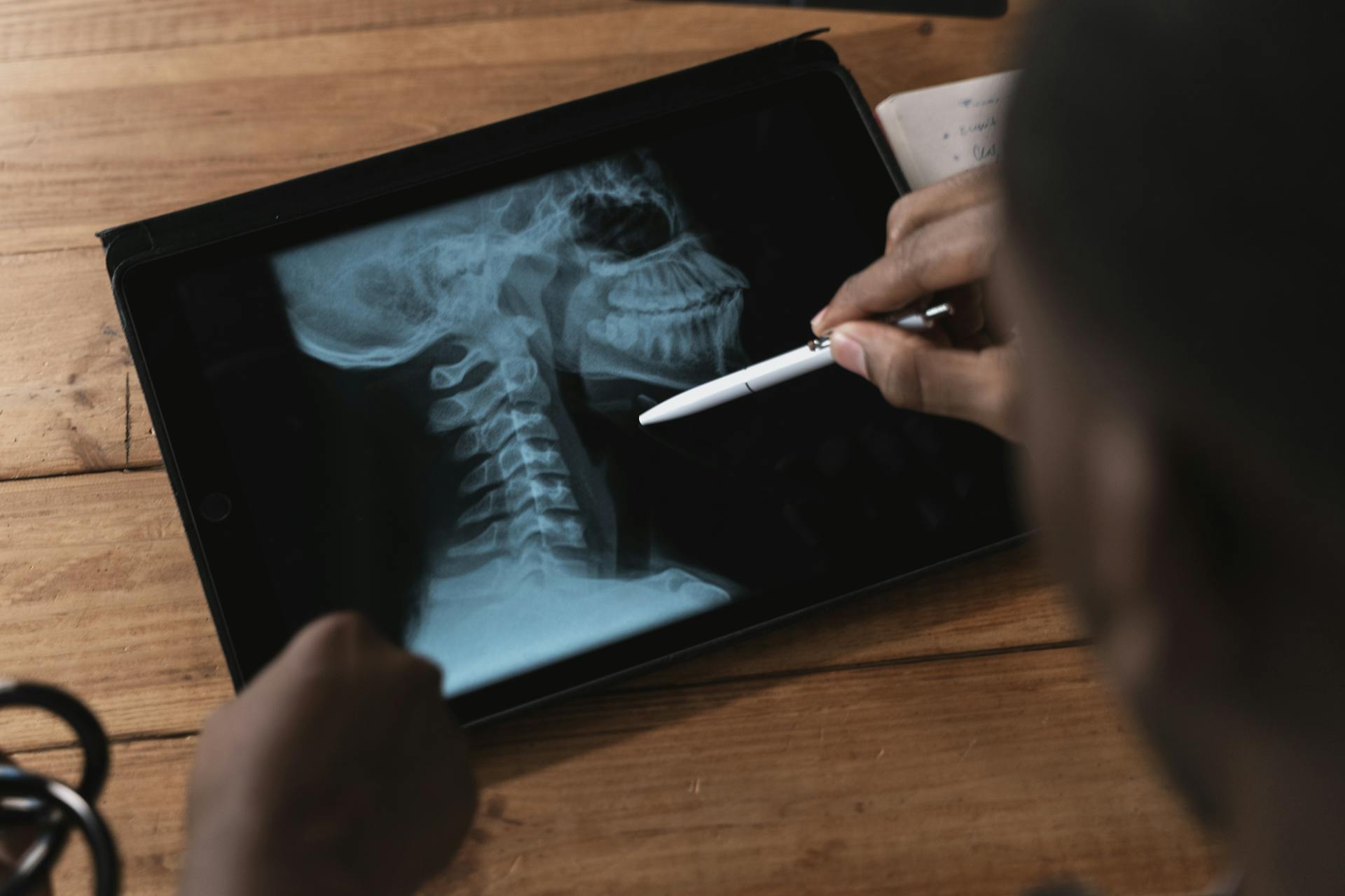 A doctor looking at scans to see if he can figure out what’s causing a patient’s dysgeusia. 