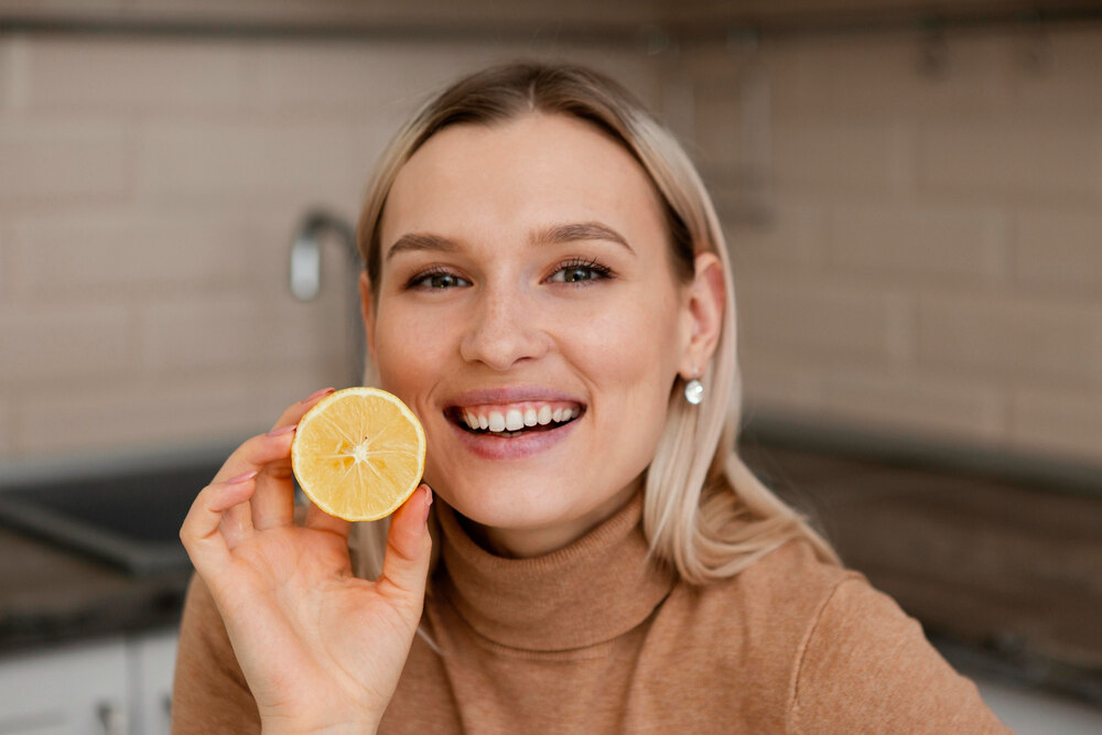 A woman attempting to mitigate her steroid related metallic taste symptoms by incorporating more citrus into her diet.