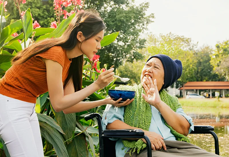  A lady with Imdelltra and Metallic taste has no appetite so she’s refusing to eat the bowl of food being offered to her. 