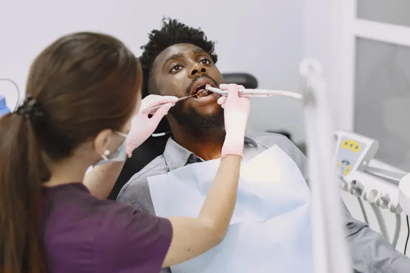 A man with a bitter taste in mouth visiting his dentist.